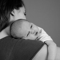 Mom holding young baby